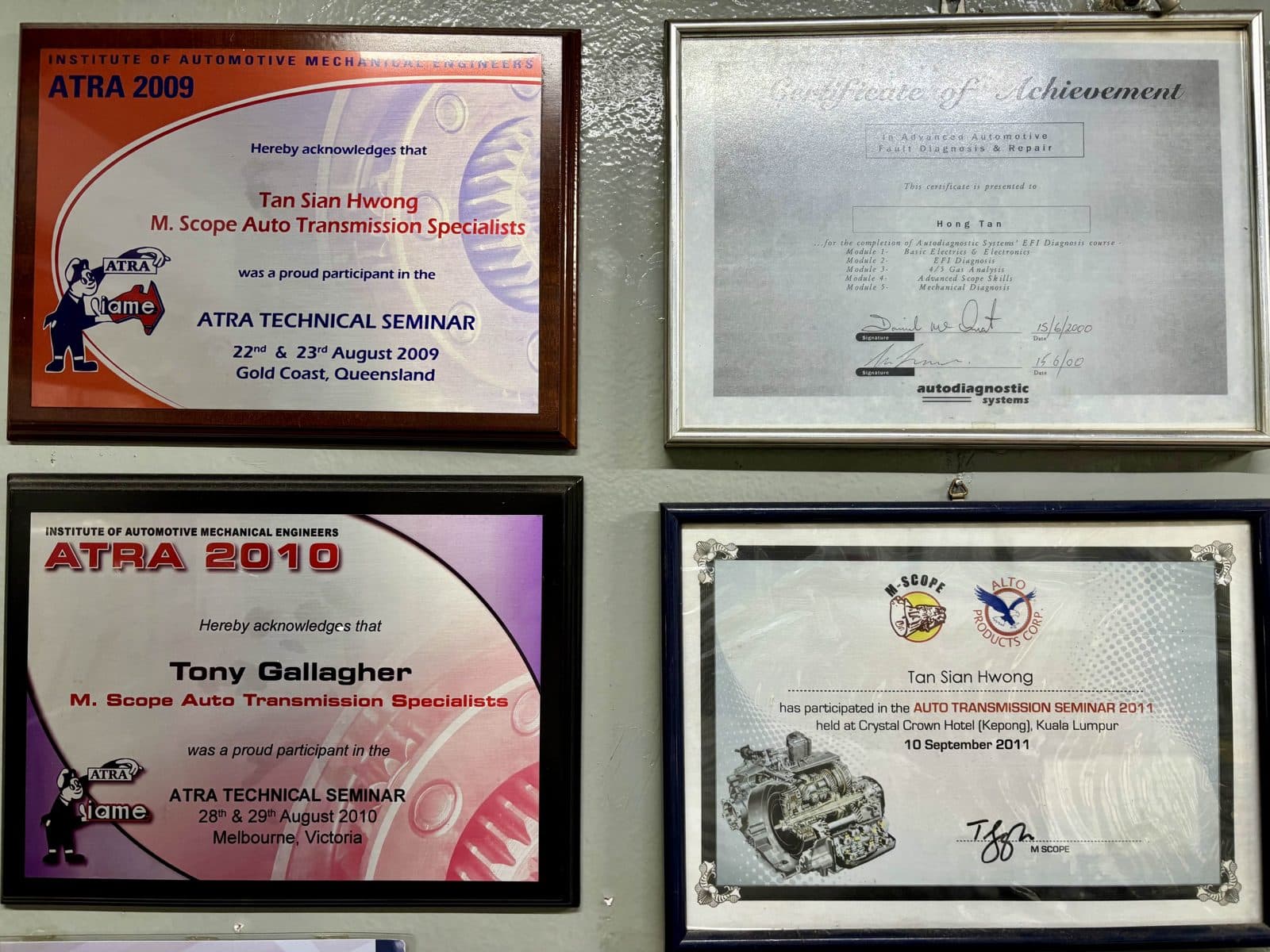 ATRA seminar plaques from 2009 and 2010, an EFI diagnosis certificate from 2000, and the 2011 Kuala Lumpur seminar.
